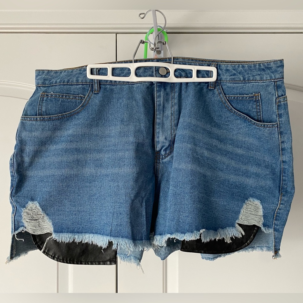 Denim shorts with faux leather pockets